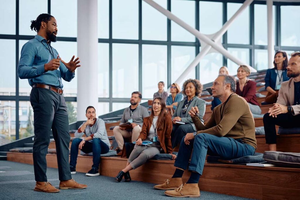 Leader at work giving a talk to colleagues