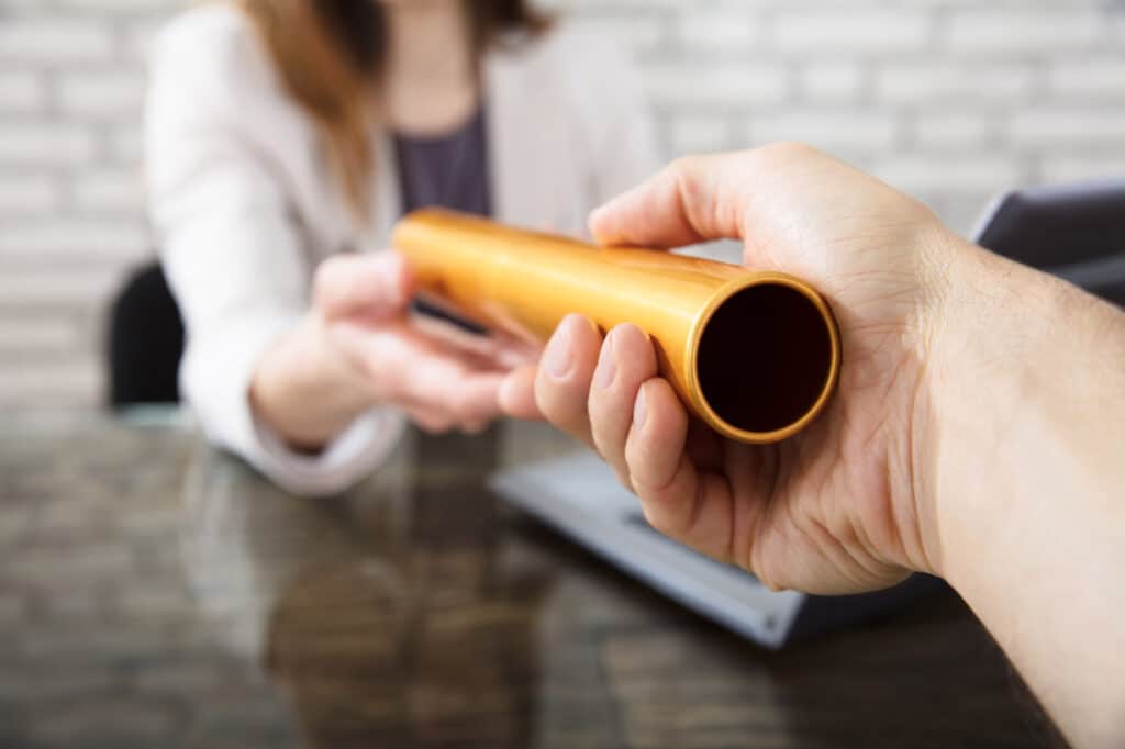 two business people passing the baton of leadership with succession planning