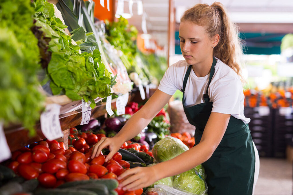 female in work uniform in supermarket